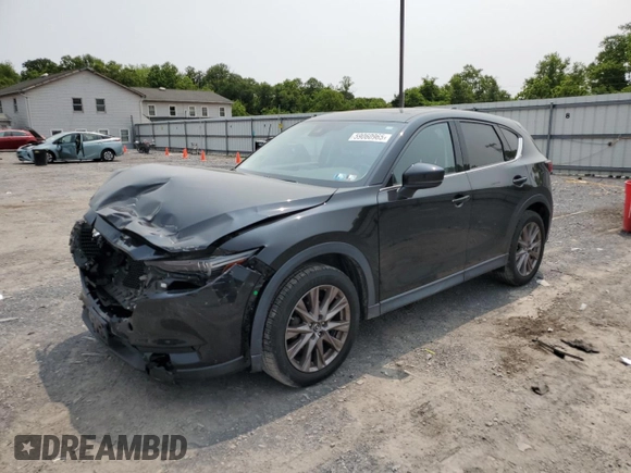 2019 Mazda CX-5 Grand Touring with VIN JM3KFBDM2K0569829, listed as a Copart auction lot 59060965 with 99,359 mi miles and Salvage title. Bid and sale history available at DreamBid. Image 1.