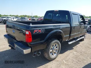 2014 Ford Super Duty F-250 SRW XL with VIN 1FT7W2BT7EEB23580, listed as a IAAI auction lot 42009328 with 102,149 mi miles. Bid and sale history available at carsss.com. Image 4.