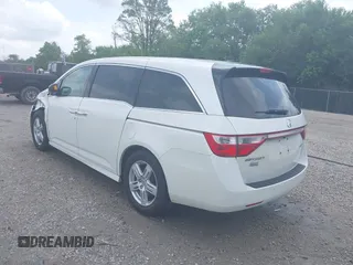 2013 Honda Odyssey Touring with VIN 5FNRL5H9XDB049390, listed as a IAAI auction lot 42532861 with 129,376 mi miles and . Bid and sale history available at DreamBid. Image 3.