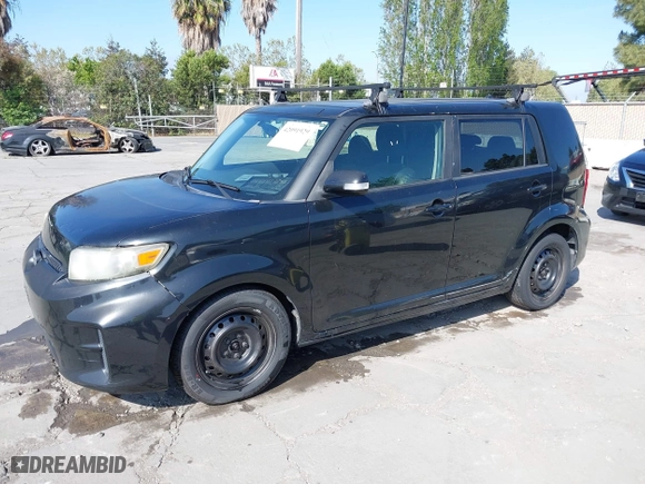 2012 Scion xB with VIN JTLZE4FE4C1143412, listed as a IAAI auction lot 42091929 with 213,501 mi miles. Bid and sale history available at carsss.com. Image 2.