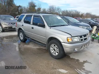 2004 Isuzu Rodeo S with VIN 4S2CK58W344311048, listed as a IAAI auction lot 41472392 with 128,732 mi miles and . Bid and sale history available at DreamBid. Image 1.