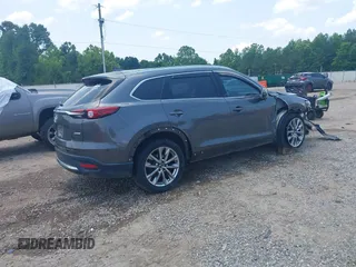 2018 Mazda CX-9 Grand Touring with VIN JM3TCADY7J0217595, listed as a IAAI auction lot 42381331 with 130,604 mi miles and . Bid and sale history available at DreamBid. Image 4.