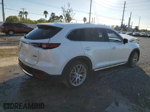 2017 Mazda CX-9 Grand Touring z VIN JM3TCADYXH0127867, wystawiony jako Copart lot #82352204 z przebiegiem 129 349 mil mil oraz Szkoda całkowita • Salvage title. Historia ofert i sprzedaży dostępna na DreamBid. Obrazek 3.