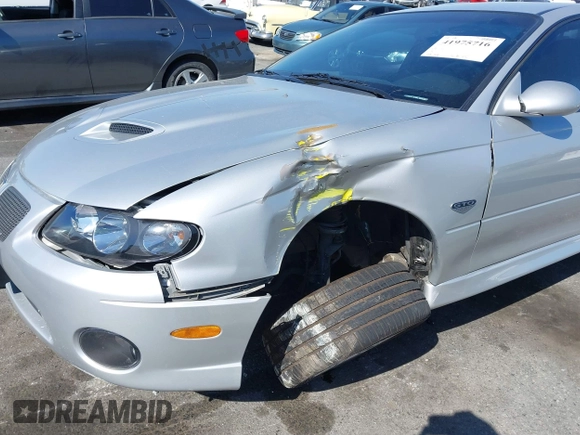 2005 Pontiac GTO with VIN 6G2VX12U05L369686, listed as a IAAI auction lot 41975716 with 64,893 mi miles. Bid and sale history available at carsss.com. Image 6.