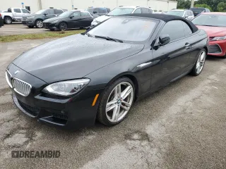 2014 BMW 6 Series 650i with VIN WBAYP9C51ED169483, listed as a Copart auction lot 74305714 with Not Provided miles and Salvage Title. Bid and sale history available at carsss.com. Image 1.
