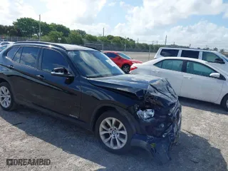 2014 BMW X1 xDrive28i with VIN WBAVL1C58EVY24362, listed as a IAAI auction lot 41938457 with 146,252 mi miles. Bid and sale history available at carsss.com. Image 1.