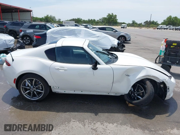 2023 Mazda MX-5 Miata Grand Touring с VIN JM1NDAM71P0560062, выставлен на аукционе IAAI как лот 42065123 с пробегом 11 320 миль миль и . История ставок и продаж доступна на DreamBid. Изображение 13.