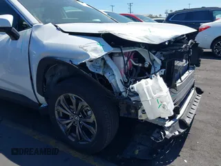 2023 Toyota RAV4 Hybrid XLE Premium with VIN JTMB6RFV0PD087237, listed as a IAAI auction lot 42606802 with 16,872 mi miles and . Bid and sale history available at DreamBid. Image 6.