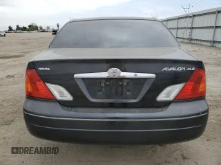 2000 Toyota Avalon XL with VIN 4T1BF28B4YU105732, listed as a Copart auction lot 54752665 with 143,855 mi miles and Salvage Title. Bid and sale history available at DreamBid. Image 6.