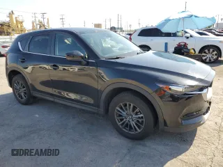 2021 Mazda CX-5 Touring with VIN JM3KFBCM8M0495899, listed as a Copart auction lot 51049235 with 31,164 mi miles and Salvage Title. Bid and sale history available at carsss.com. Image 4.