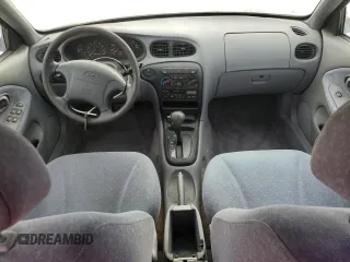 2000 Hyundai Elantra GLS z VIN KMHJF35F9YU032902, wystawiony jako Copart lot #45145955 z przebiegiem 79 229 mil mil oraz Czysty tytuł • Clean title. Historia ofert i sprzedaży dostępna na DreamBid. Obrazek 8.