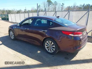 2017 Kia Optima LX with VIN 5XXGT4L33HG163285, listed as a IAAI auction lot 41802193 with 122,159 mi miles. Bid and sale history available at carsss.com. Image 3.