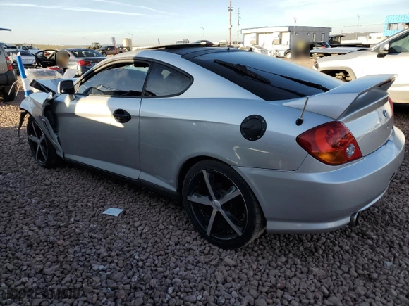 2004 Hyundai Tiburon GT with VIN KMHHN65F44U130202, listed as a Copart auction lot 43193404 with 207,694 mi miles and Salvage Title. Bid and sale history available at carsss.com. Image 2.