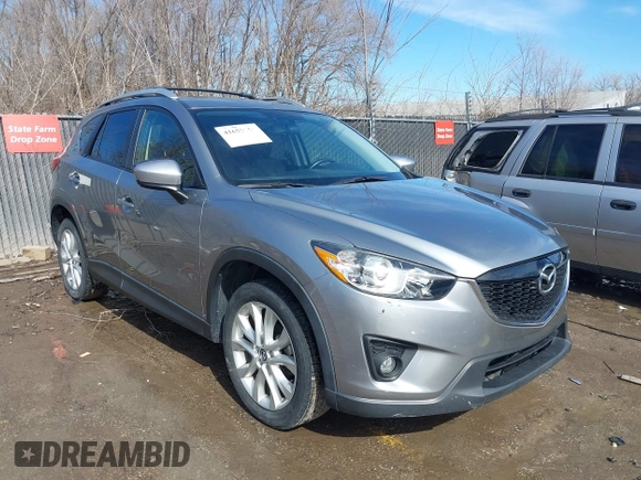2014 Mazda CX-5 Grand Touring with VIN JM3KE2DY8E0375025, listed as a IAAI auction lot 41657755 with 103,601 mi miles. Bid and sale history available at carsss.com. Image 1.