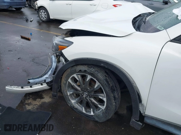 2016 Mazda CX-5 Grand Touring with VIN JM3KE4DY0G0705691, listed as a IAAI auction lot 40880798 with 130,624 mi miles. Bid and sale history available at carsss.com. Image 6.