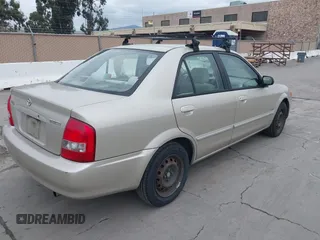 2000 Mazda Protege DX with VIN JM1BJ2223Y0212144, listed as a IAAI auction lot 41570436 with 221,430 mi miles and . Bid and sale history available at DreamBid. Image 4.