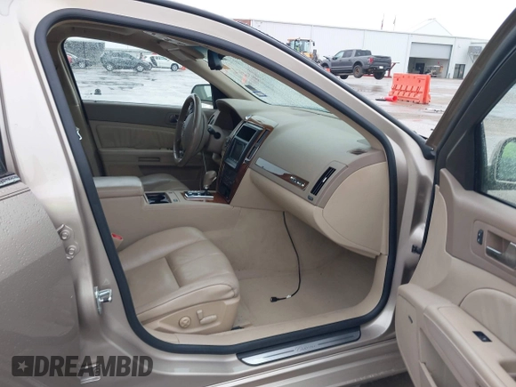 2005 Cadillac STS z VIN 1G6DC67A950171835, wystawiony jako IAAI lot #41599105 z przebiegiem 74 235 mil mil oraz . Historia ofert i sprzedaży dostępna na DreamBid. Obrazek 5.