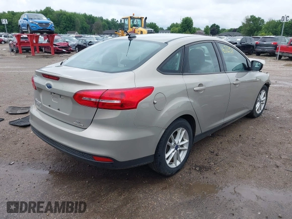 2016 Ford Focus SE z VIN 1FADP3F28GL300925, wystawiony jako IAAI lot #42563251 z przebiegiem 93 247 mil mil oraz . Historia ofert i sprzedaży dostępna na DreamBid. Obrazek 4.