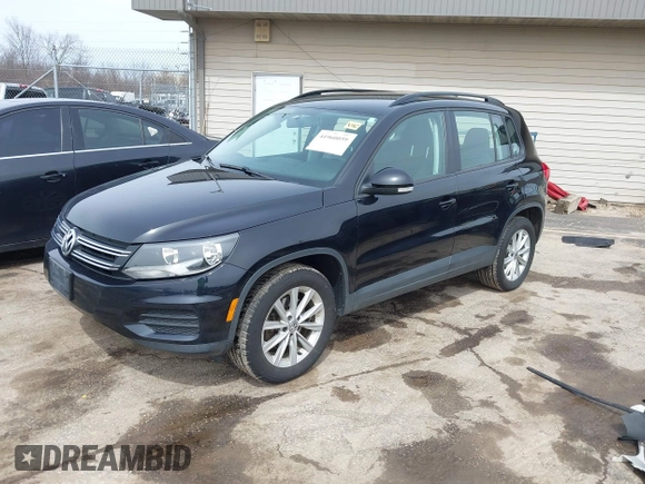 2018 Volkswagen Tiguan with VIN WVGBV7AX3JK002325, listed as a IAAI auction lot 41960059 with 57,619 mi miles and . Bid and sale history available at DreamBid. Image 2.
