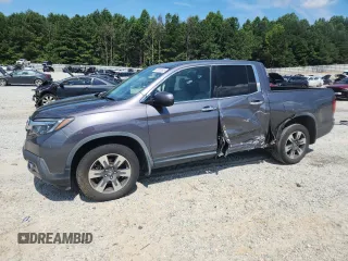 2017 Honda Ridgeline RTL-E with VIN 5FPYK3F79HB031142, listed as a Copart auction lot 62365885 with 134,517 mi miles and Salvage title. Bid and sale history available at DreamBid. Image 1.