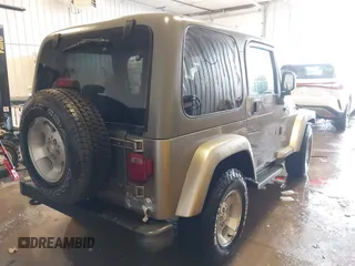 2003 Jeep Wrangler Sahara z VIN 1J4FA59S83P343234, wystawiony jako IAAI lot #41644074 z przebiegiem 197 461 mil mil oraz . Historia ofert i sprzedaży dostępna na DreamBid. Obrazek 4.
