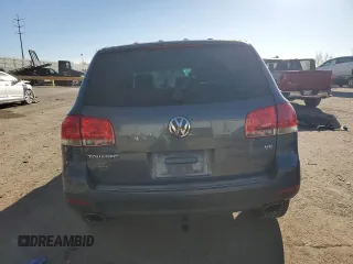 2004 Volkswagen Touareg z VIN WVGEM77L64D051760, wystawiony jako Copart lot #87044304 z przebiegiem Nie podano mil oraz Szkoda całkowita • Salvage title. Historia ofert i sprzedaży dostępna na DreamBid. Obrazek 6.