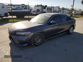2022 Honda Civic LX z VIN 2HGFE2F26NH517811, wystawiony jako Copart lot #52933645 z przebiegiem Nie podano mil oraz Szkody całkowita. Historia ofert i sprzedaży dostępna na DreamBid. Obrazek 1.