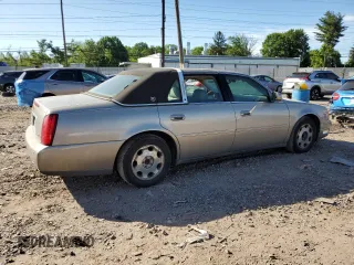 2001 Cadillac DeVille DHS z VIN 1G6KE57Y21U250470, wystawiony jako Copart lot #57334785 z przebiegiem 66 703 mil mil oraz Tytuł czysty. Historia ofert i sprzedaży dostępna na DreamBid. Obrazek 3.