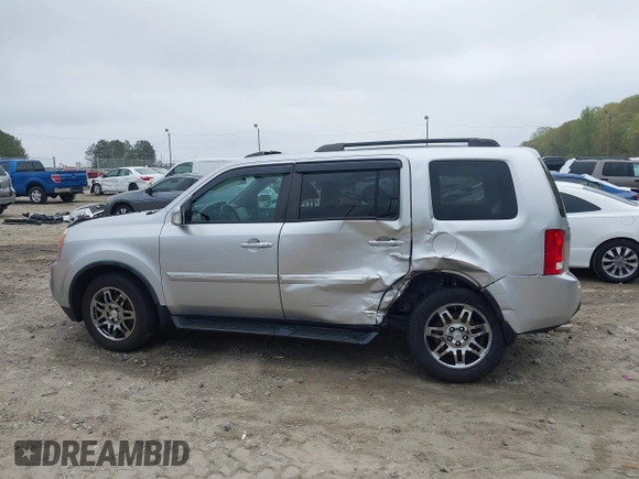 2014 Honda Pilot Touring with VIN 5FNYF4H91EB011934, listed as a IAAI auction lot 41929415 with 227,343 mi miles and . Bid and sale history available at DreamBid. Image 14.