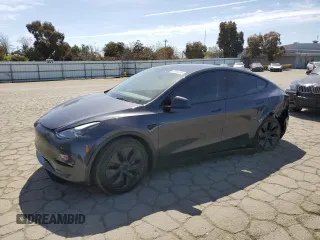 2025 Tesla Model Y Long Range with VIN 7SAYGDED4SF240354, listed as a Copart auction lot 52049745 with 6,785 mi miles and Salvage Title. Bid and sale history available at DreamBid. Image 1.