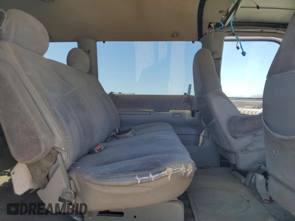 1996 GMC Safari z VIN 1GKDM19W4TB522520, wystawiony jako Copart lot #59058955 z przebiegiem Nie podano mil oraz Tytuł czysty. Historia ofert i sprzedaży dostępna na DreamBid. Obrazek 11.