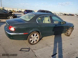2004 Jaguar X-Type with VIN SAJEA51C24WE14915, listed as a Copart auction lot 77828734 with 0 mi miles and Salvage Title. Bid and sale history available at carsss.com. Image 3.