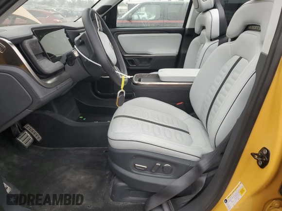 2022 Rivian R1T Launch Edition z VIN 7FCTGAAL2NN011755, wystawiony jako Copart lot #59934185 z przebiegiem 12 261 mil mil oraz Szkoda całkowita • Salvage title. Historia ofert i sprzedaży dostępna na DreamBid. Obrazek 7.