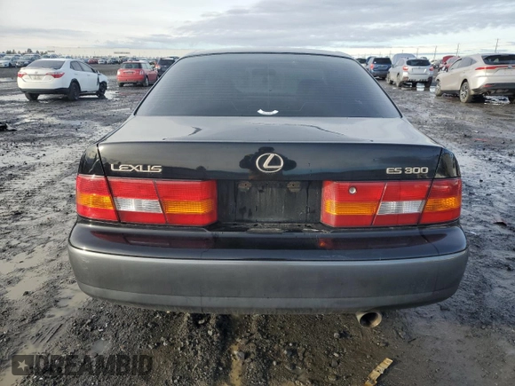 1997 Lexus ES 300 Luxury Sport Sdn with VIN JT8BF22G5V0057703, listed as a Copart auction lot 84712734 with 160,575 mi miles and Salvage Title. Bid and sale history available at carsss.com. Image 6.