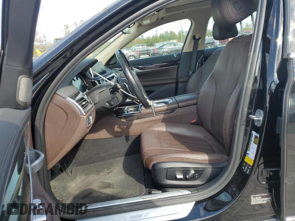 2018 BMW 7 Series 740i xDrive with VIN WBA7E4C54JGV23901, listed as a Copart auction lot 77322824 with 70,922 mi miles and Salvage Title. Bid and sale history available at carsss.com. Image 7.