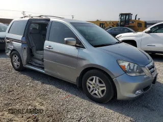 2006 Honda Odyssey EX-L z VIN 5FNRL38756B087695, wystawiony jako Copart lot #60122525 z przebiegiem 213 221 mil mil oraz Szkoda całkowita • Salvage title. Historia ofert i sprzedaży dostępna na DreamBid. Obrazek 4.