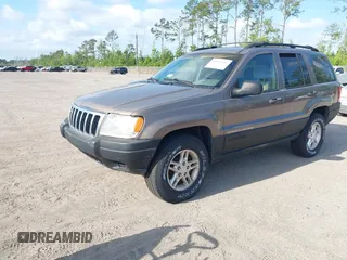 2001 Jeep Grand Cherokee Laredo with VIN 1J4GX48S91C559693, listed as a IAAI auction lot 42152103 with 152,713 mi miles and . Bid and sale history available at DreamBid. Image 2.