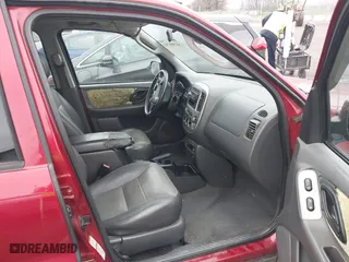 2004 Ford Escape XLT with VIN 1FMCU03114KA54144, listed as a IAAI auction lot 41908703 with 238,791 mi miles. Bid and sale history available at carsss.com. Image 5.