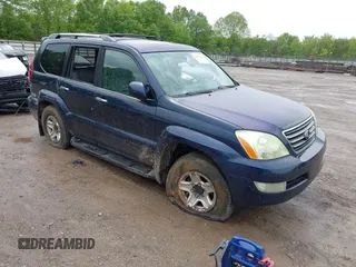 2009 Lexus GX with VIN JTJBT20X090176601, listed as a IAAI auction lot 42095814 with 325,397 mi miles. Bid and sale history available at carsss.com. Image 1.