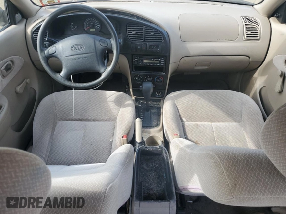 2003 Kia Spectra with VIN KNAFB121935241589, listed as a Copart auction lot 71933194 with 61,738 mi miles and Salvage Title. Bid and sale history available at DreamBid. Image 8.