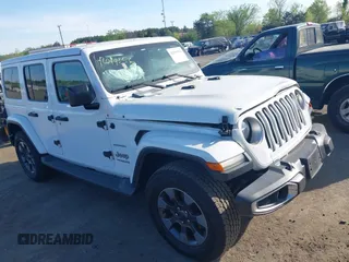2018 Jeep Wrangler Unlimited Sahara z VIN 1C4HJXEG9JW227829, wystawiony jako IAAI lot #42099356 z przebiegiem 130 259 mil mil oraz . Historia ofert i sprzedaży dostępna na DreamBid. Obrazek 1.