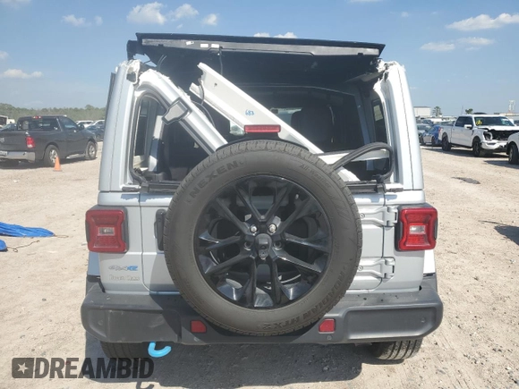 2024 Jeep Wrangler Sahara with VIN 1C4RJXP60RW122620, listed as a Copart auction lot 50622135 with 22,238 mi miles and Salvage Title. Bid and sale history available at DreamBid. Image 6.