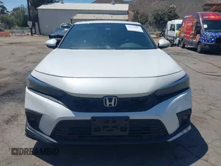 2022 Honda Civic Sport Touring z VIN 19XFL1G82NE000678, wystawiony jako IAAI lot #42221847 z przebiegiem 90 869 mil mil oraz . Historia ofert i sprzedaży dostępna na DreamBid. Obrazek 12.
