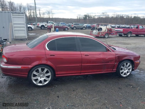 2005 Jaguar X-Type 3.0L with VIN SAJWA51A05WE55760, listed as a IAAI auction lot 41732516 with NaN miles. Bid and sale history available at carsss.com. Image 14.