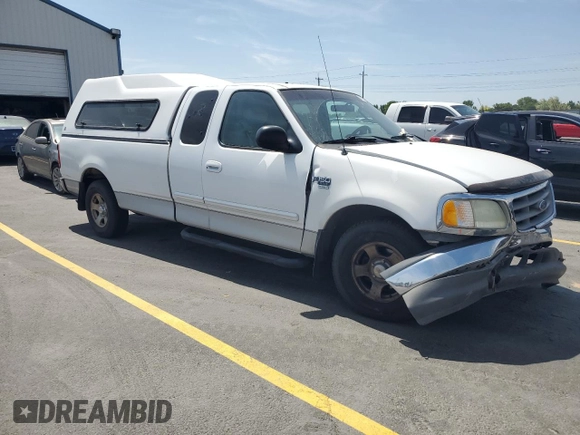 2003 Ford F-150 XL with VIN 2FTRX17L23CA17128, listed as a Copart auction lot 60144965 with 121,055 mi miles and Salvage title. Bid and sale history available at DreamBid. Image 4.