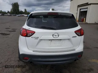 2014 Mazda CX-5 Grand Touring with VIN JM3KE4DY2E0354795, listed as a Copart auction lot 70713544 with 58,848 mi miles and Salvage Title. Bid and sale history available at DreamBid. Image 6.