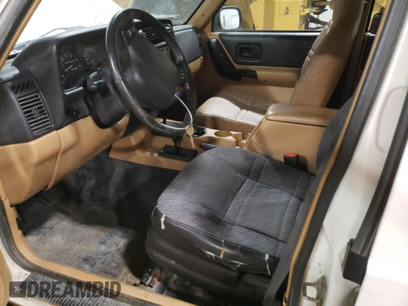 1998 Jeep Cherokee Sport with VIN 1J4FJ68S2WL239891, listed as a Copart auction lot 62966025 with 128,226 mi miles and Clean title. Bid and sale history available at DreamBid. Image 7.