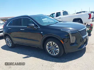 2024 Cadillac XT4 AWD Premium Luxury z VIN 1GYFZDR44RF144801, wystawiony jako IAAI lot #42646613 z przebiegiem 37 358 mil mil oraz . Historia ofert i sprzedaży dostępna na DreamBid. Obrazek 14.