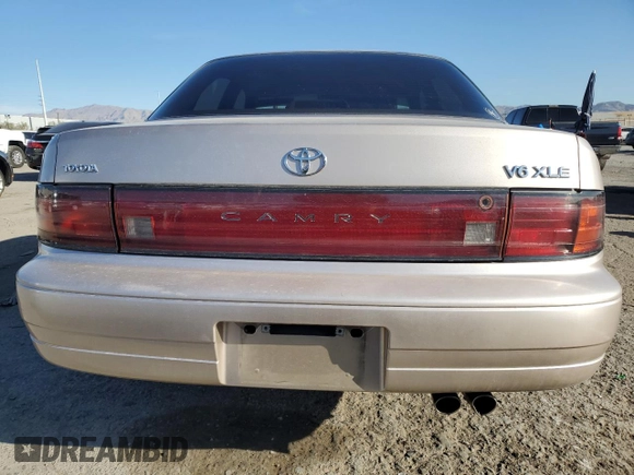 1994 Toyota Camry XLE with VIN JT2GK13E0R0017831, listed as a Copart auction lot 49887485 with 143,303 mi miles and Salvage Title. Bid and sale history available at carsss.com. Image 6.