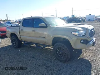 2018 Toyota Tacoma SR with VIN 3TMCZ5AN7JM125425, listed as a IAAI auction lot 40459066 with 85,182 mi miles. Bid and sale history available at carsss.com. Image 1.